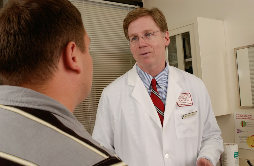 A doctor discussing care with a patient in a medical consultation
